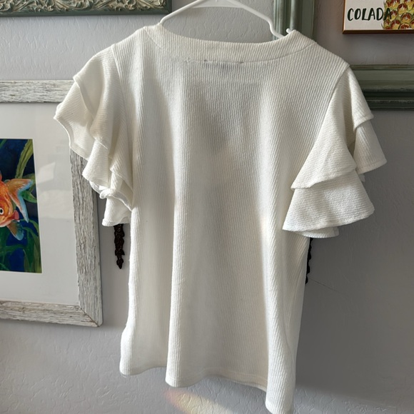 Cute flutter sleeve shoulder white dressy shirt Has a V neck with Diamond accent - Picture 5 of 5